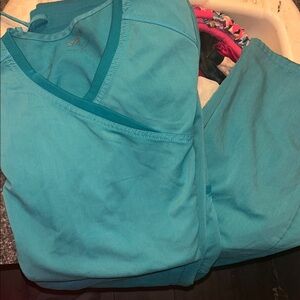 Scrub star top is a small. The bottoms are small.